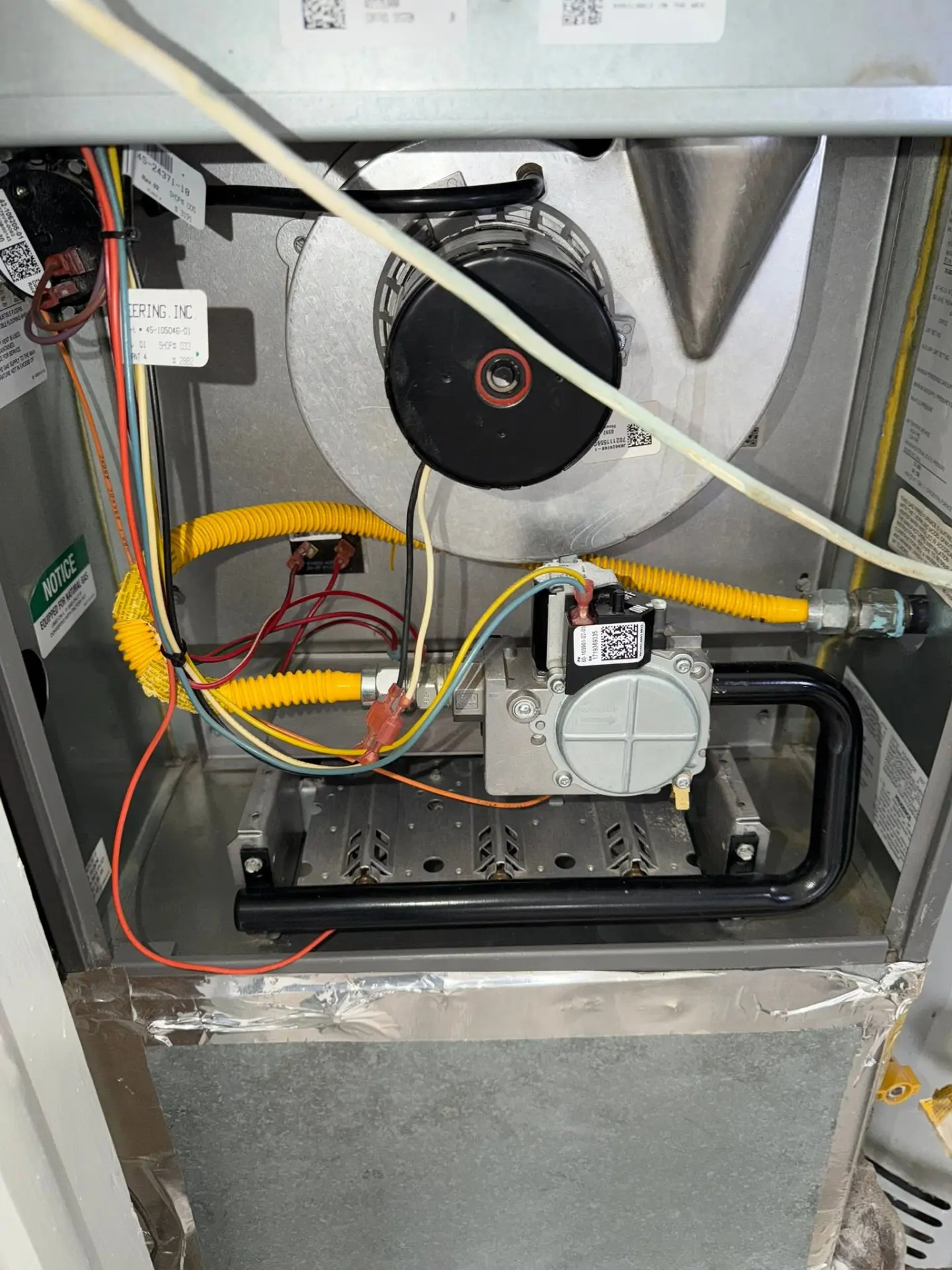 Open furnace cabinet during a Redeemed HVAC service call